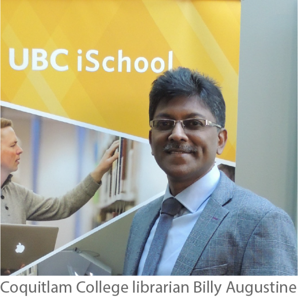 Billy smiles at the camera. He has short cropped black hair, a mustache, glasses, and dark skin. He is wearing a tie, collared shirt, and jacket. He stands in front of a UBC iSchool poster.